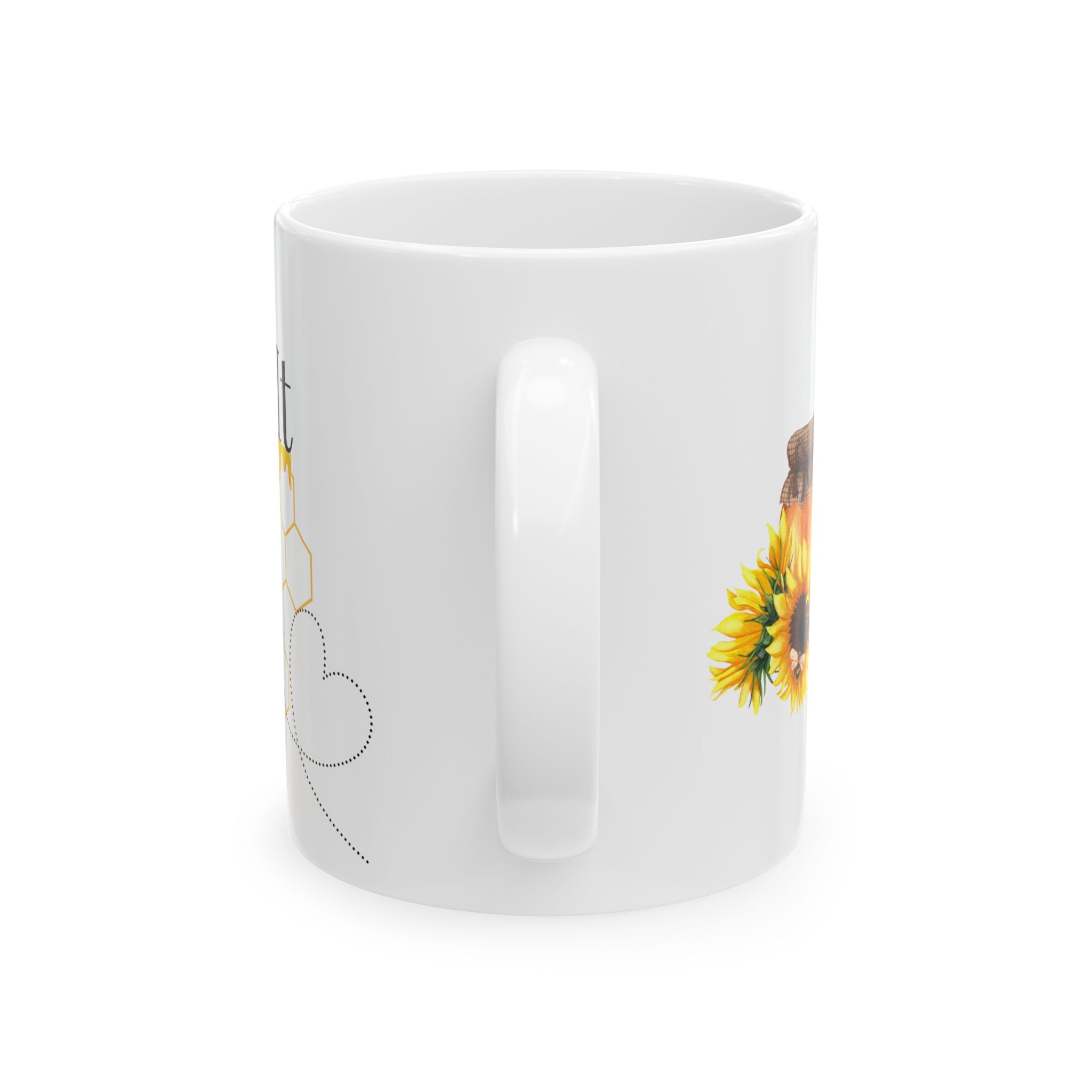 White ceramic coffee mug with bee and honeycomb line art, sunflower cluster on side