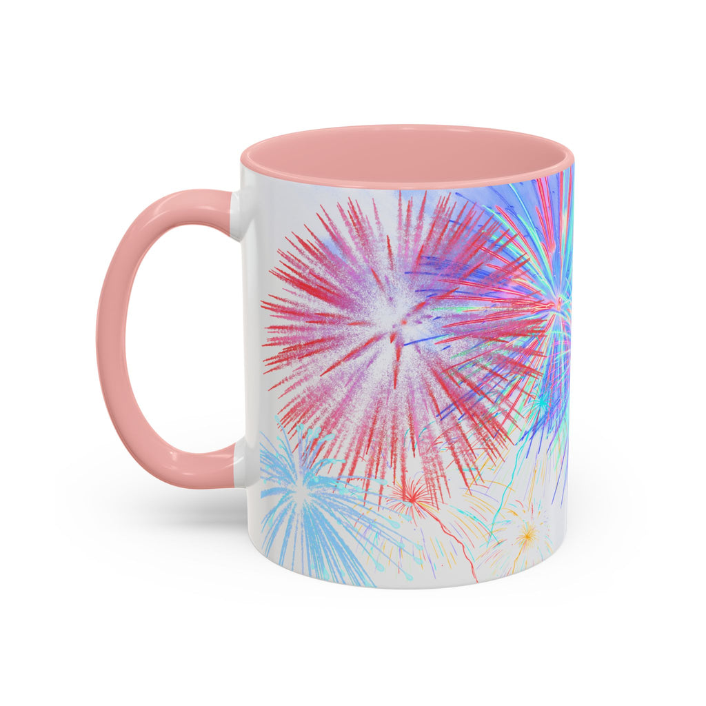 Ceramic coffee mug with pink handle, colorful fireworks print, white body, pink interior