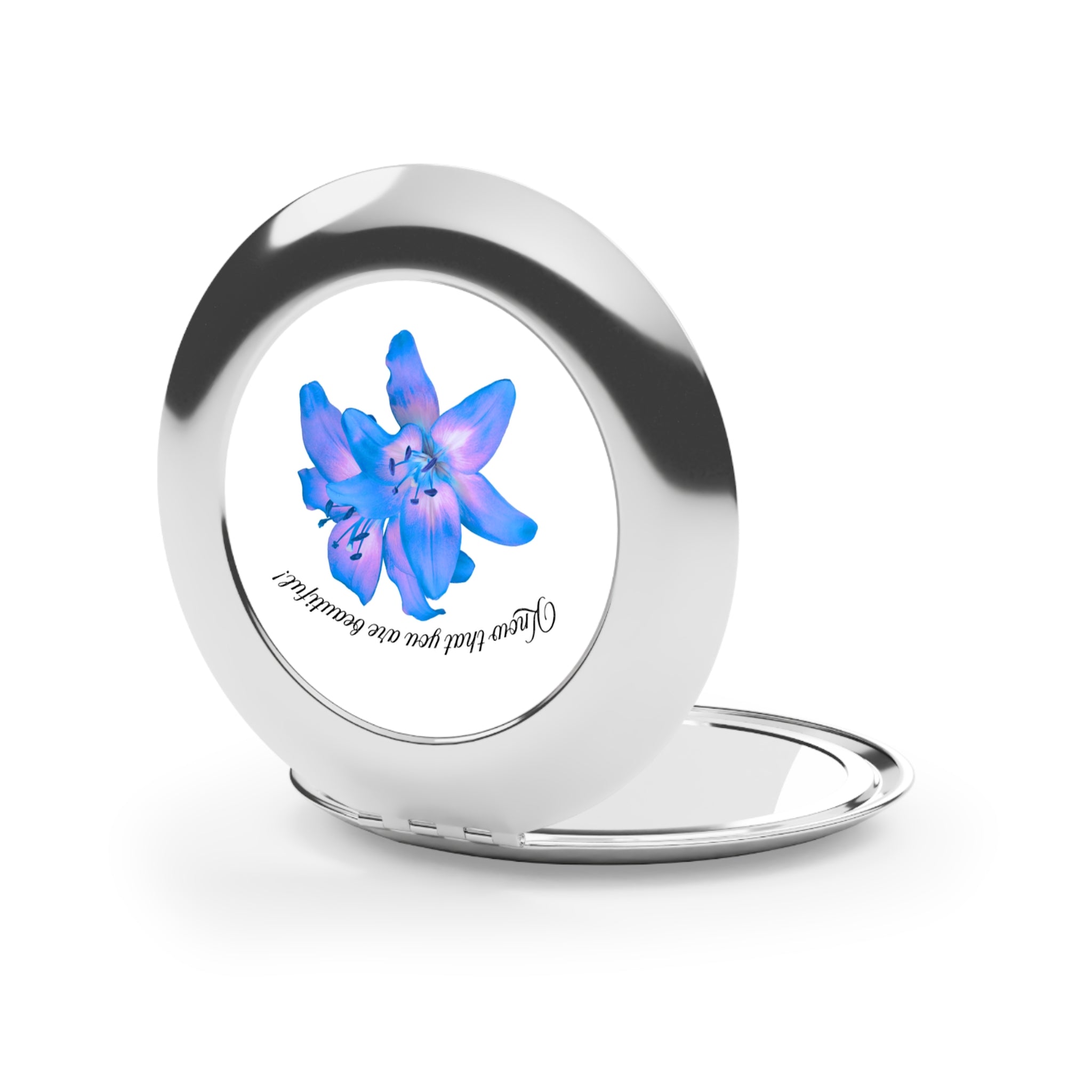 Compact mirror side view with silver glossy frame and blue floral graphic