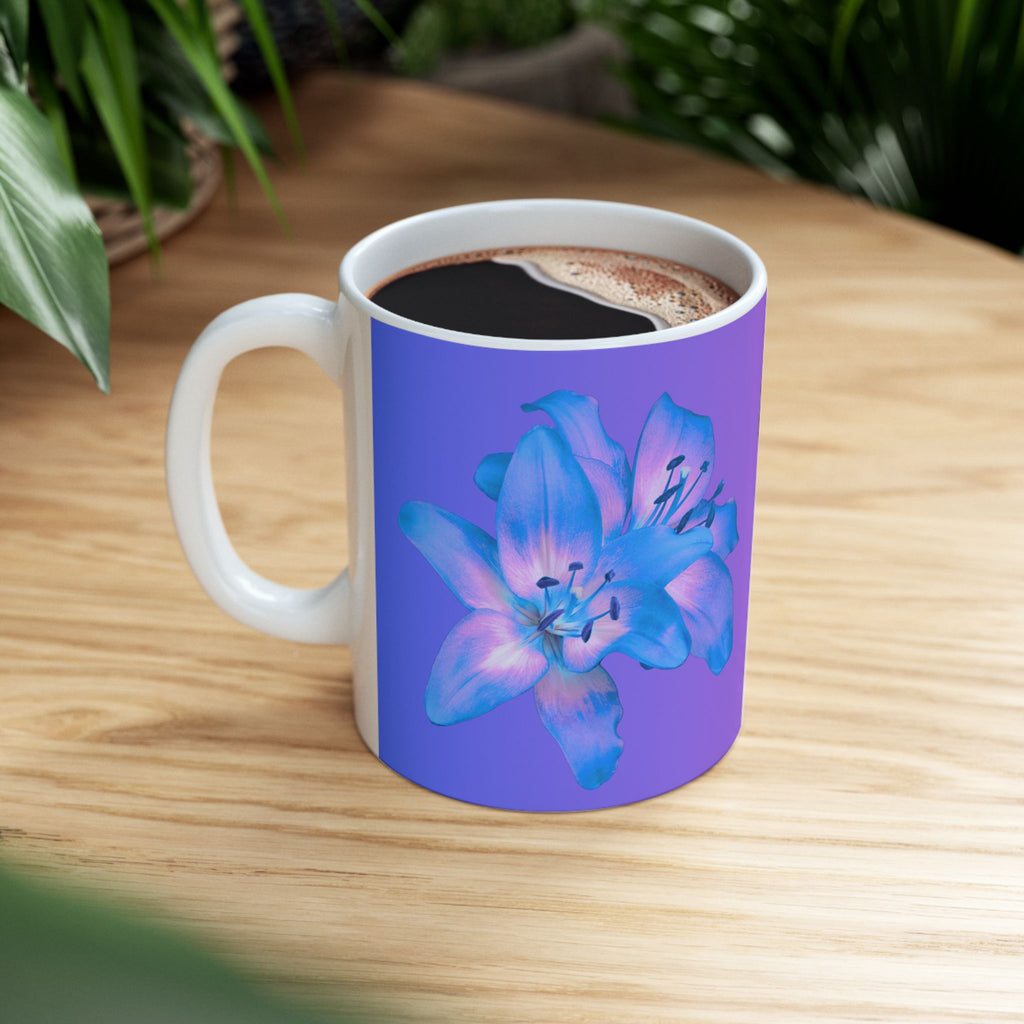 Ceramic coffee mug with blue flower print and Coffee style design, filled with coffee