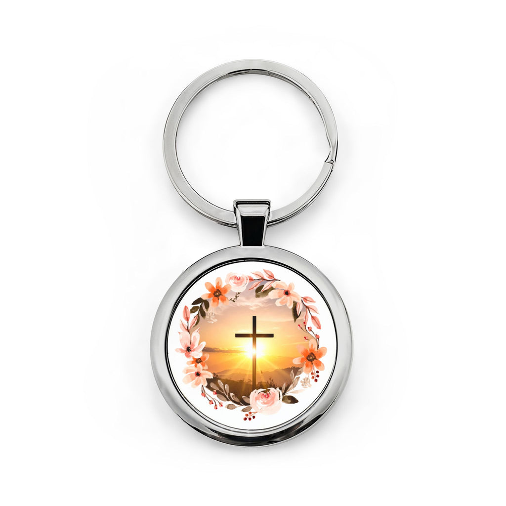 Stainless steel round keychain with split ring; circular pendant shows a cross at sunrise with flowers