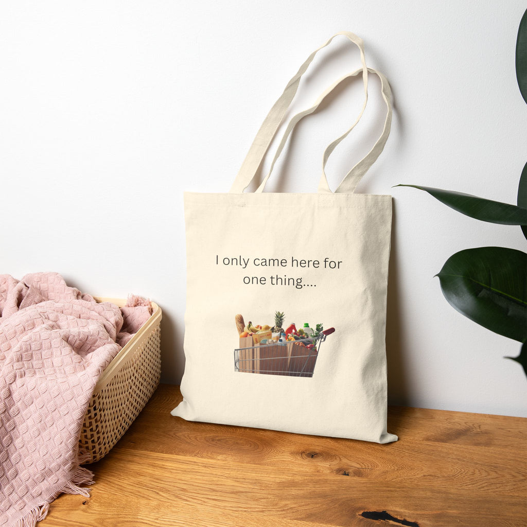 Natural canvas grocery tote bag with handles and 'I only came here for one thing' print