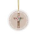Round ceramic cross ornament with pink roses and floral accents, white lace border, gold cord