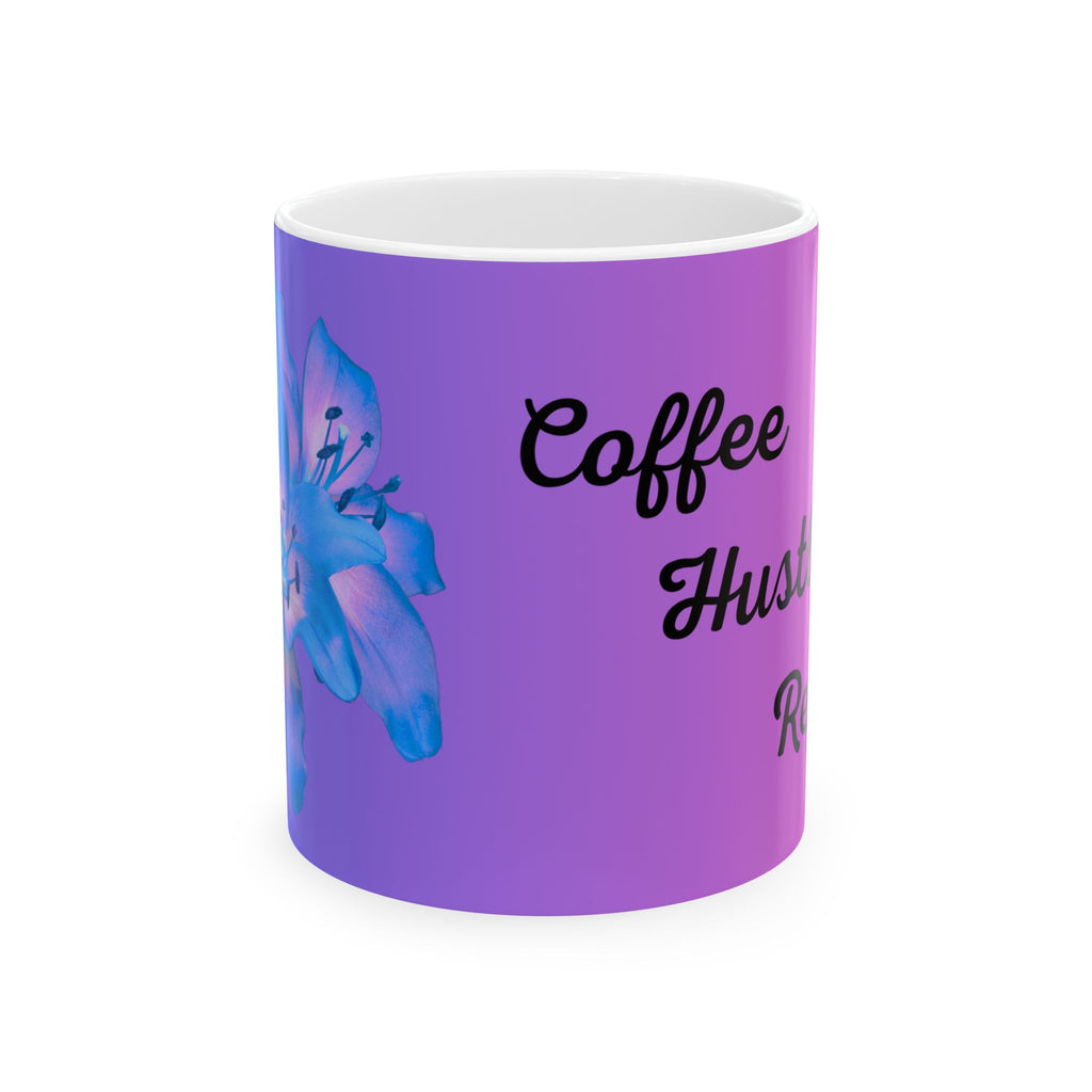 Purple ceramic mug with blue flower graphic and black Coffee Hustle Repeat text