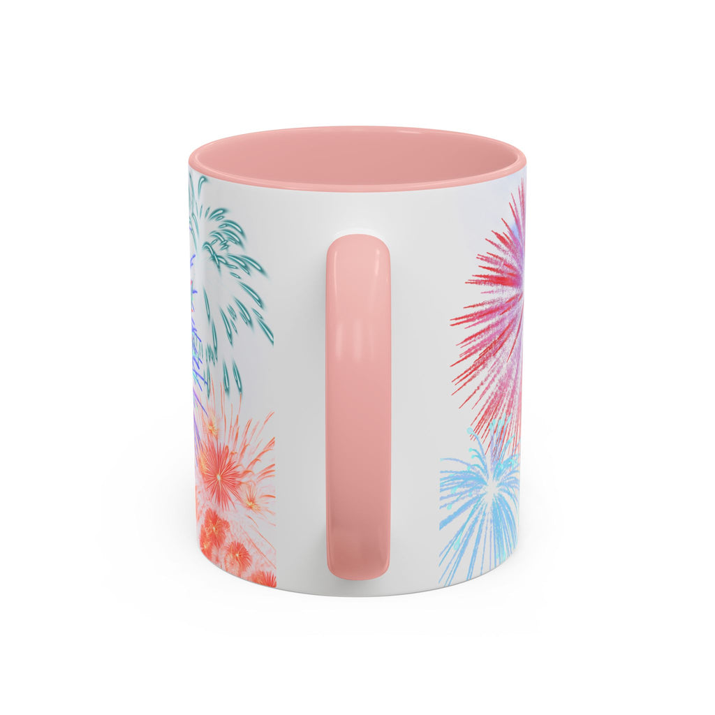 Ceramic coffee mug with pink handle, fireworks print on white body, pink interior