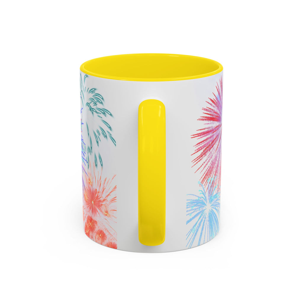 Ceramic coffee mug with yellow rim and handle; white design shows fireworks on sides.