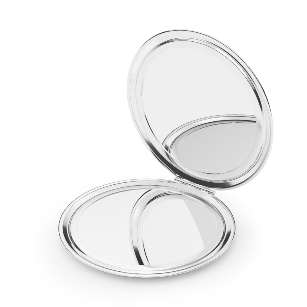 Compact mirror opened flat: two silver round mirrors with reflective surfaces