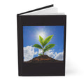 Black hardcover notebook with plant cover art and "My Growth!" text on front