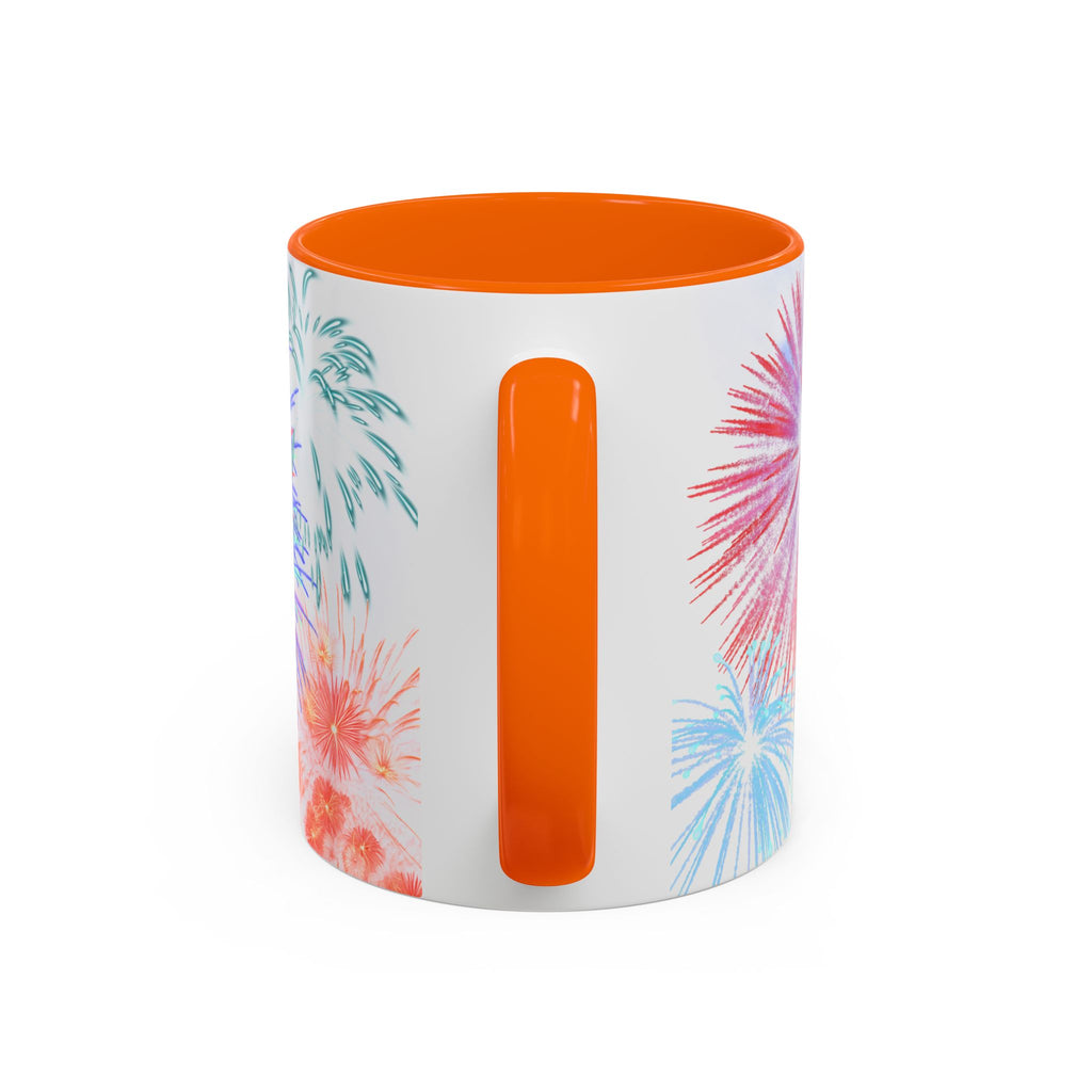 Ceramic coffee mug with orange rim and handle; white design shows fireworks on sides.