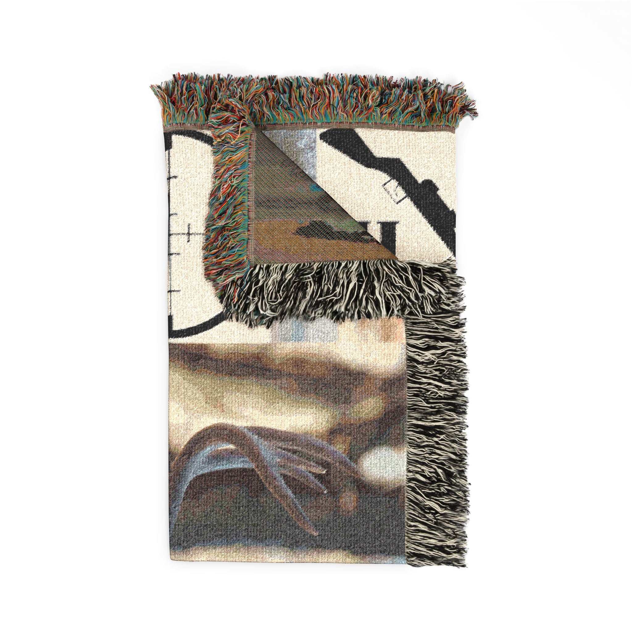 Corner view of deer hunting woven blanket with rifle graphic, multicolor fringe trim