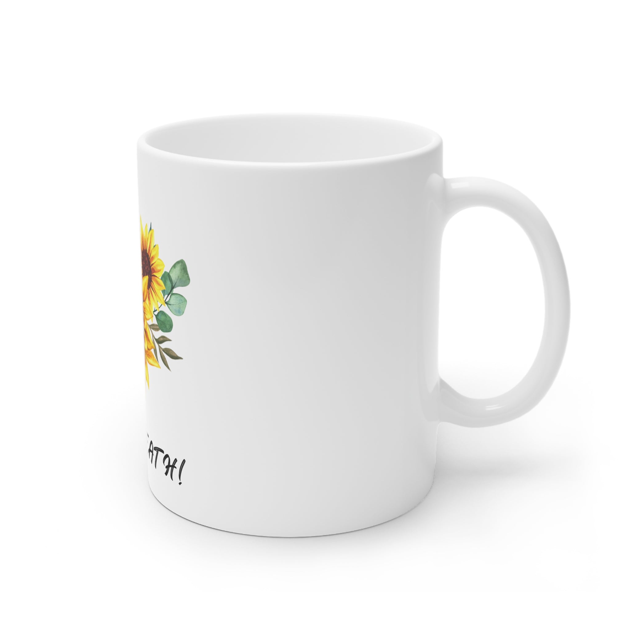 White ceramic mug with partial sunflower artwork and “Just B…” script on side