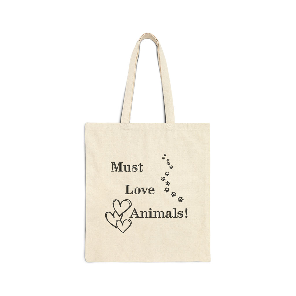 Natural canvas tote bag with "Must Love Animals!" text and paw print hearts design