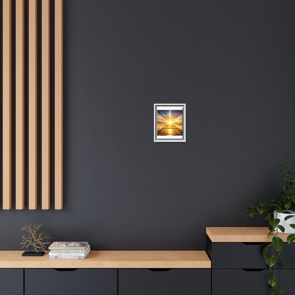 Framed matte canvas wall art with sunrise light rays and small central glow in a silver frame